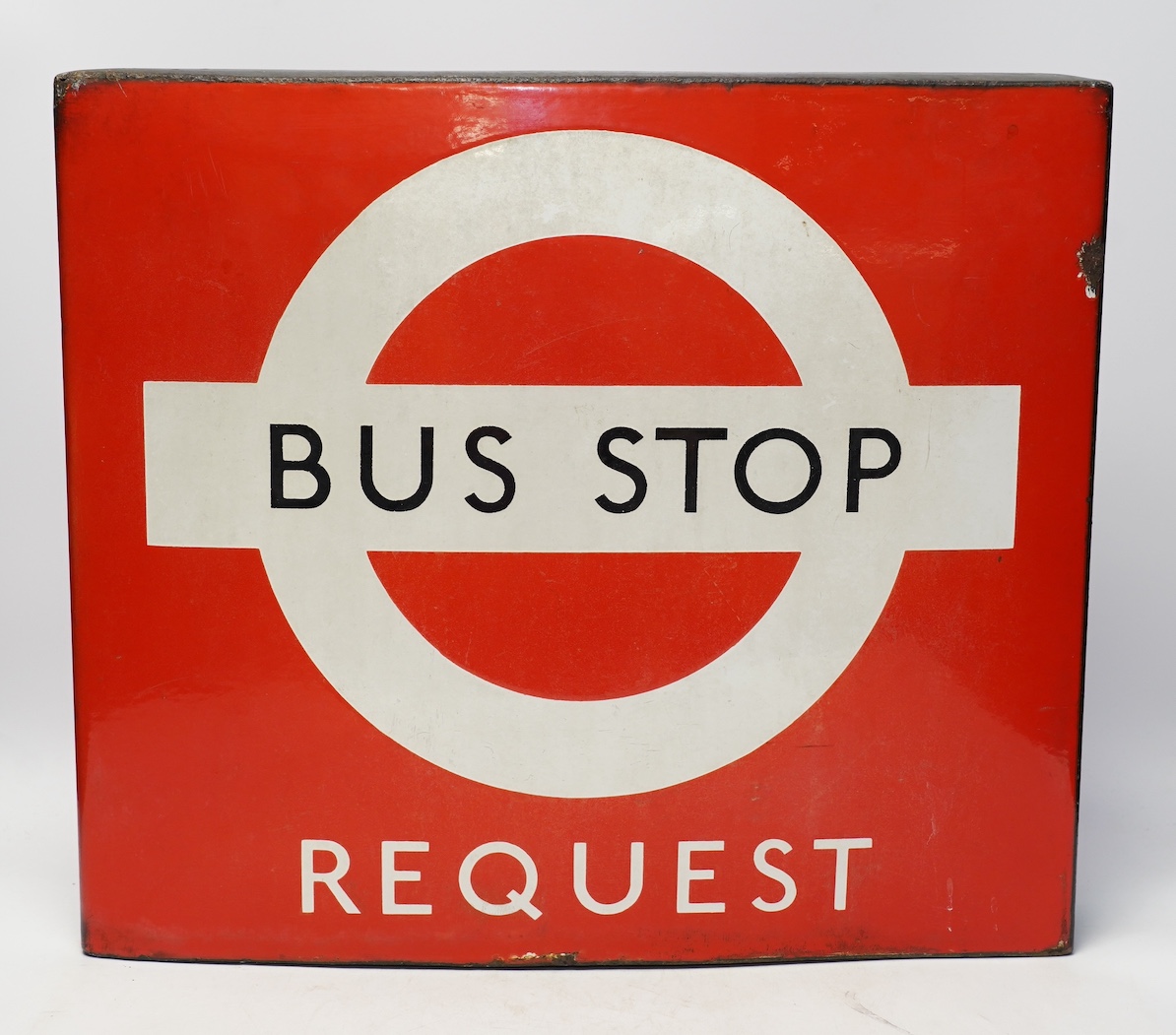 A London Transport double sided enamel Bus Stop Request sign, serial number on applied panel to base; 12137, 40cm high, 46cm wide. Condition - fair to good condition, with minor losses to the edge of the enamel, etc.